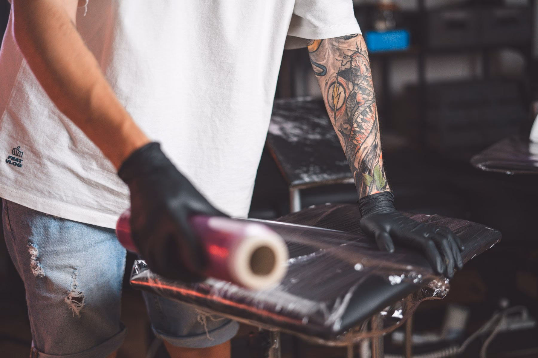 What causes cross-contamination in a tattoo studio?