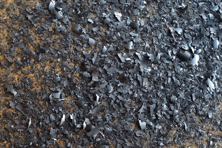 Why is metal contamination a threat to the environment?