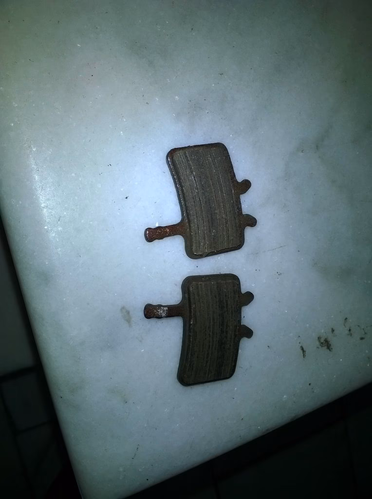Why do brake pads get contaminated?